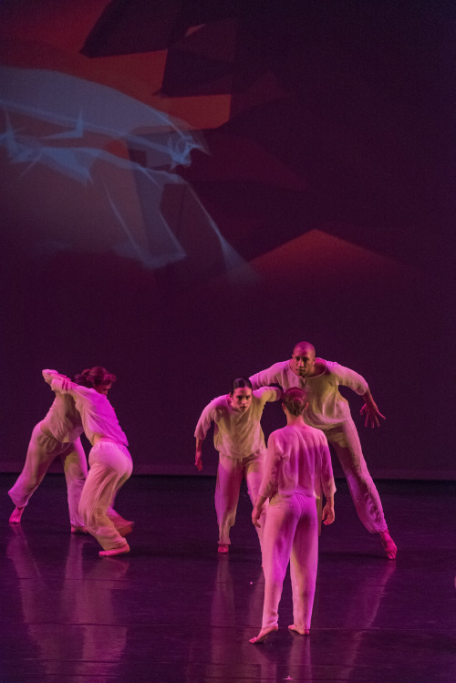 ESDC ensemble dancing blow still projected on cyclorama at The Egg.